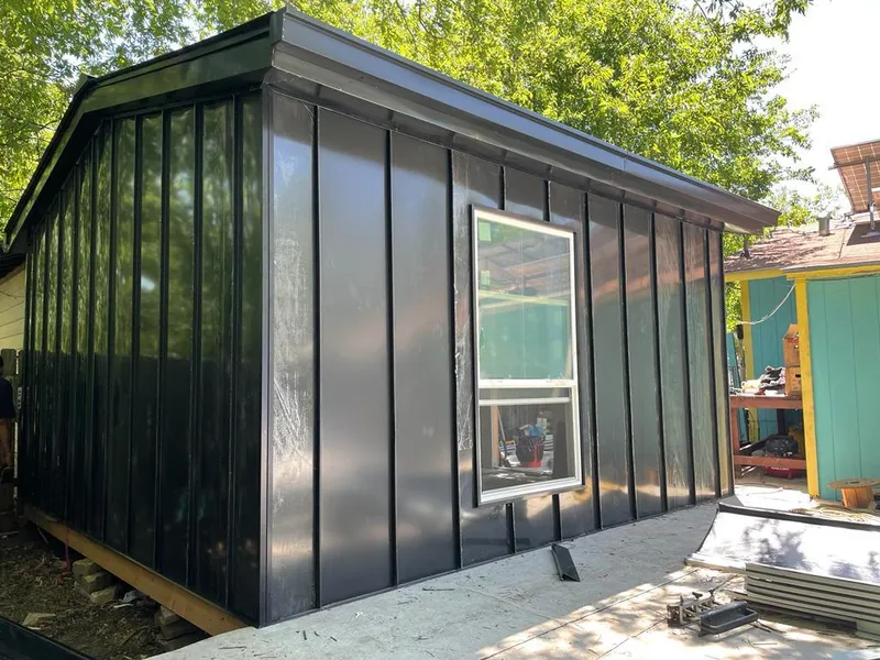 Black standing seam metal wall panels for Metal Roof Installation in Celina